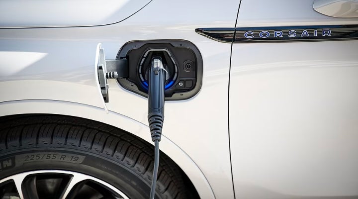 An electric charger is shown plugged into the charging port of a Lincoln Corsair® Grand Touring
model. | Joe Rizza Lincoln of Orland Park in Orland Park IL