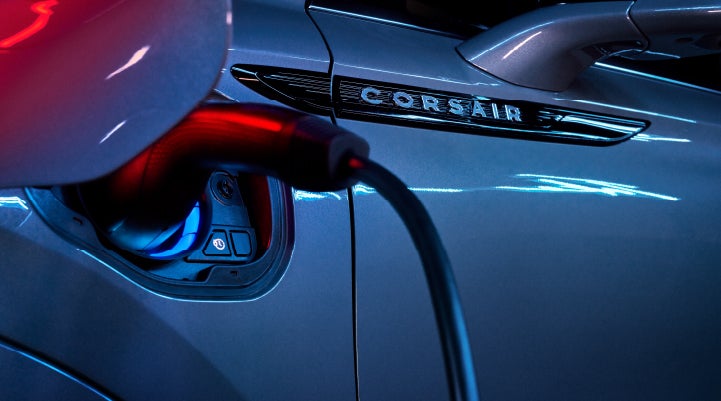 A charger plugged into the charging port of a 2024 Lincoln Corsair® Plug-in Hybrid model. | Joe Rizza Lincoln of Orland Park in Orland Park IL